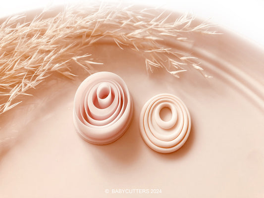 Embossed Abstract Oval Twirl Shape with Oval Hole Polymer Clay Jewellery Cutter