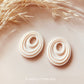 Embossed Abstract Oval Twirl Shape with Oval Hole Polymer Clay Jewellery Cutter